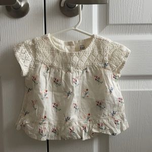 Short sleeve embroidered too with florals and details.